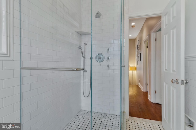 bathroom with tile patterned floors and walk in shower