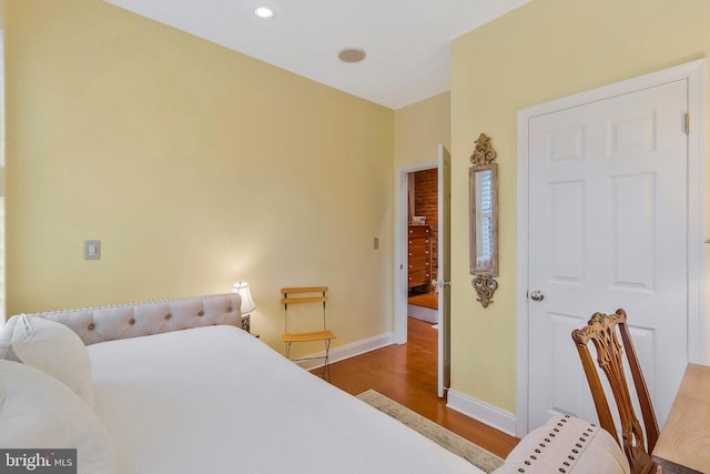 bedroom with hardwood / wood-style floors