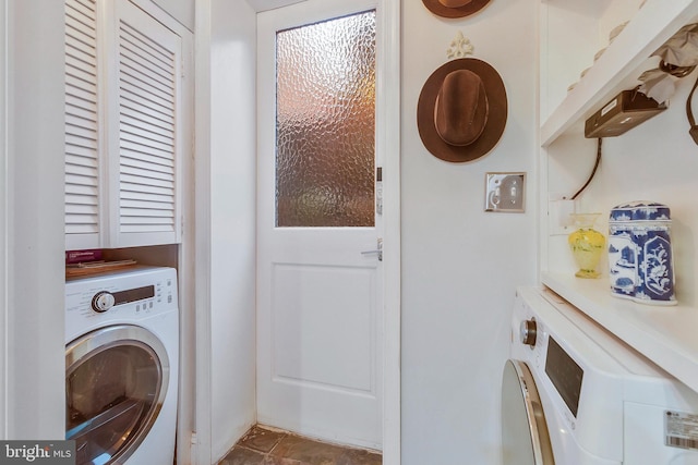 washroom with cabinets and washer / dryer