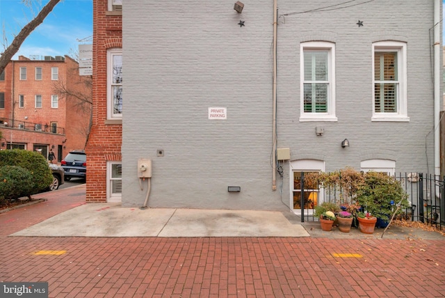 view of side of property featuring a patio area