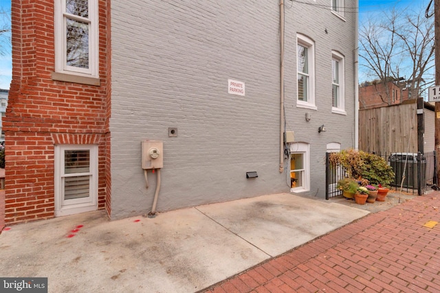 view of side of home with a patio