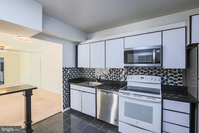 kitchen with white cabinets, sink, and stainless steel appliances