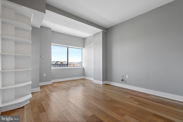 unfurnished room featuring light wood-type flooring