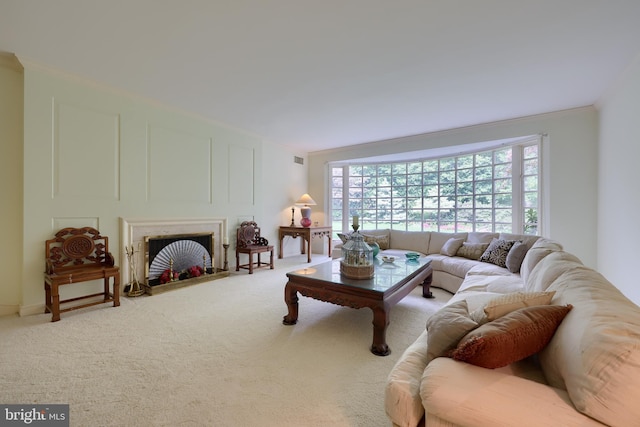 living room with carpet floors and ornamental molding