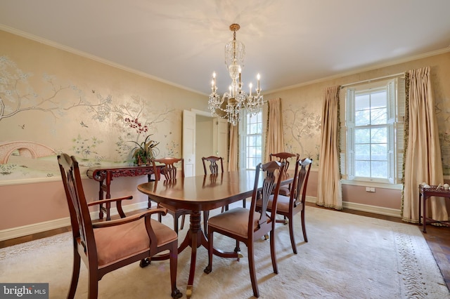 dining room featuring crown molding, a chandelier, and light wood-type flooring