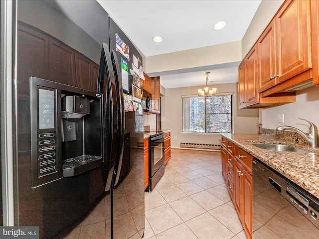 kitchen with light stone counters, baseboard heating, sink, black appliances, and an inviting chandelier