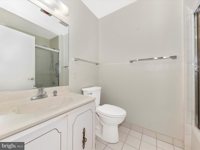 bathroom with tile patterned flooring, vanity, and toilet