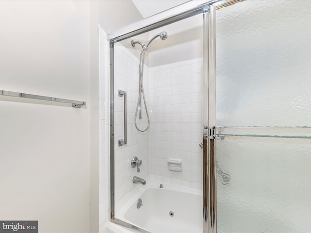 bathroom featuring shower / bath combination with glass door