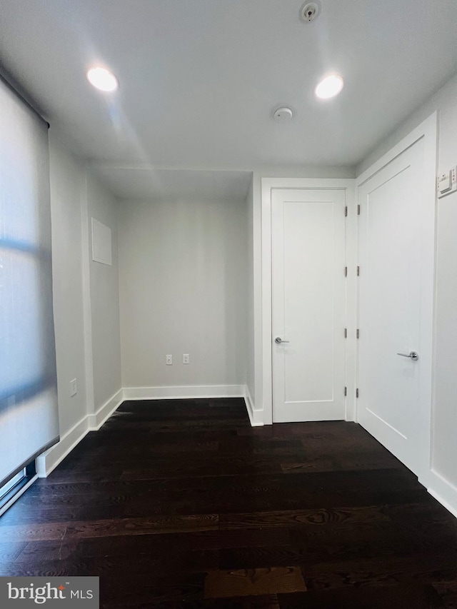 spare room featuring dark hardwood / wood-style floors