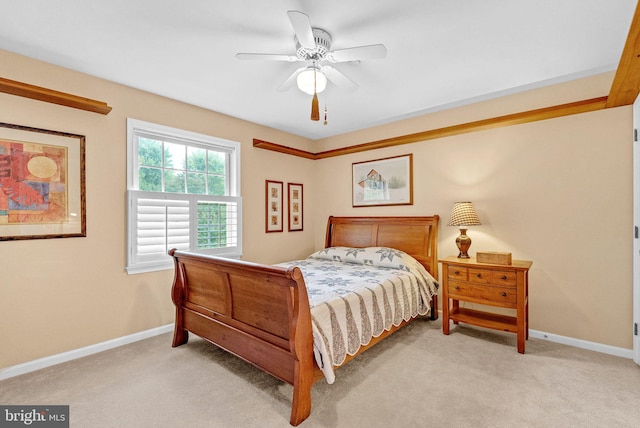 bedroom featuring light carpet and ceiling fan