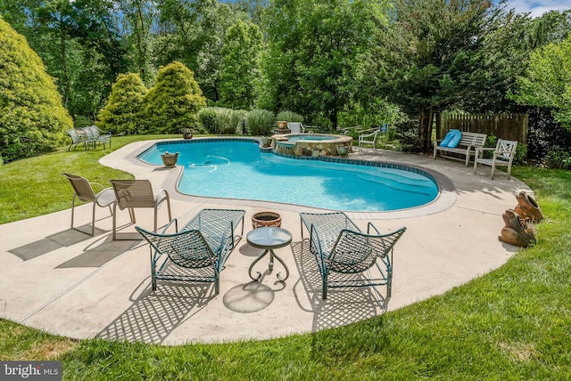 view of swimming pool featuring a lawn, an in ground hot tub, and a patio