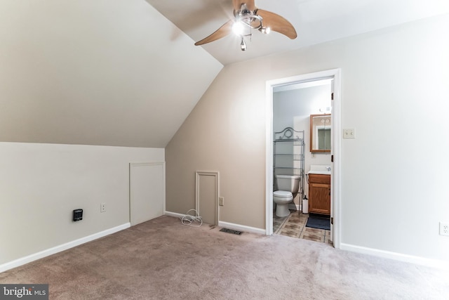 additional living space featuring lofted ceiling, ceiling fan, and carpet floors