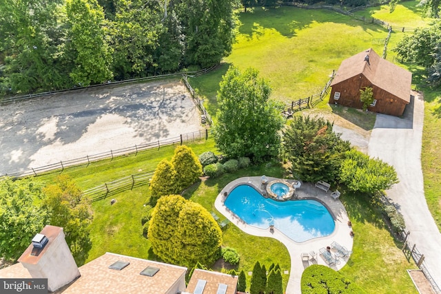 birds eye view of property with a rural view