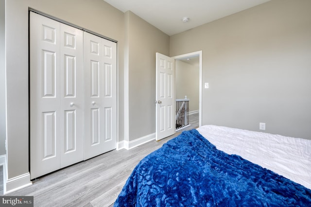 bedroom featuring a closet and wood-type flooring