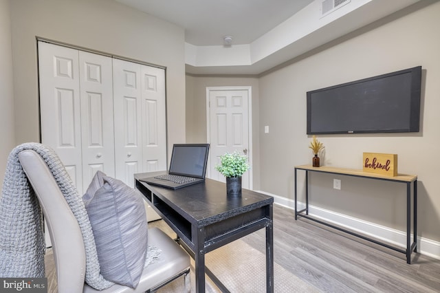 office area with light hardwood / wood-style flooring