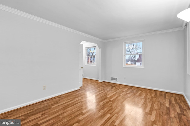 unfurnished room with light hardwood / wood-style flooring and ornamental molding