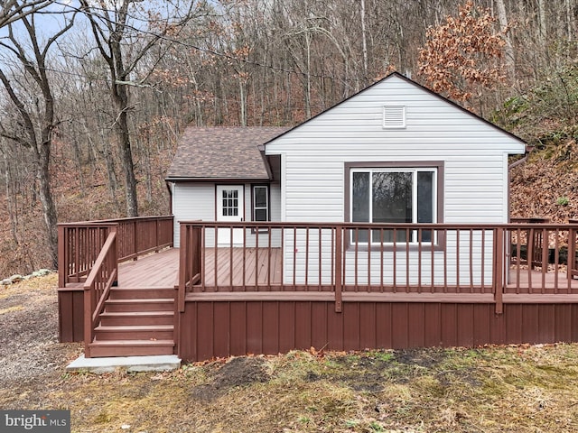 back of property featuring a deck