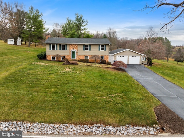 split foyer home with a garage and a front yard