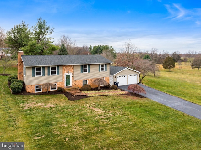 raised ranch with a front lawn and a garage