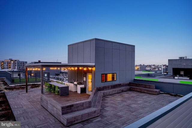 view of patio terrace at dusk