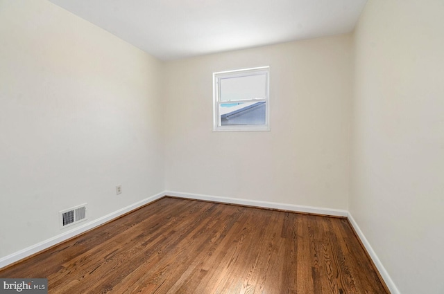 unfurnished room featuring wood-type flooring