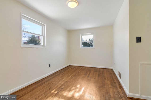 unfurnished room featuring hardwood / wood-style floors