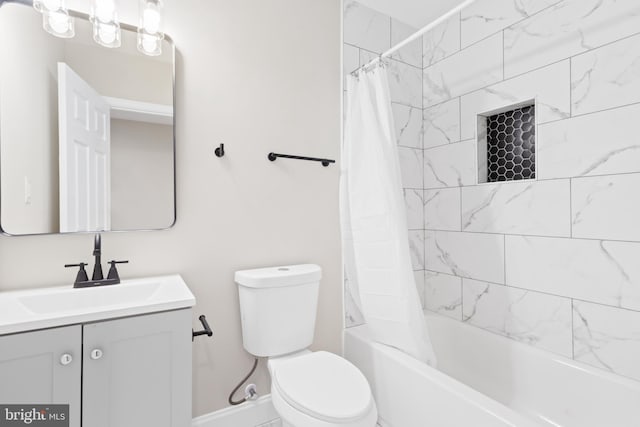 full bathroom featuring vanity, toilet, and shower / tub combo with curtain