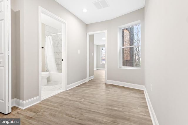 hallway featuring light hardwood / wood-style flooring