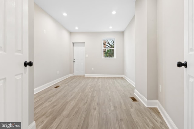 spare room with light wood-type flooring