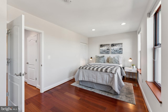 bedroom with dark wood-type flooring