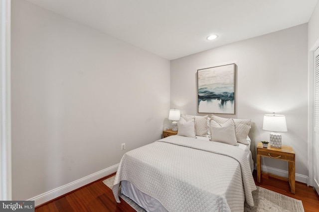 bedroom with hardwood / wood-style floors