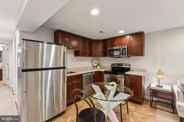 kitchen featuring stainless steel appliances and sink