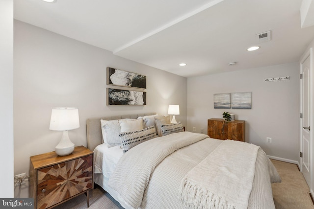 bedroom featuring light carpet