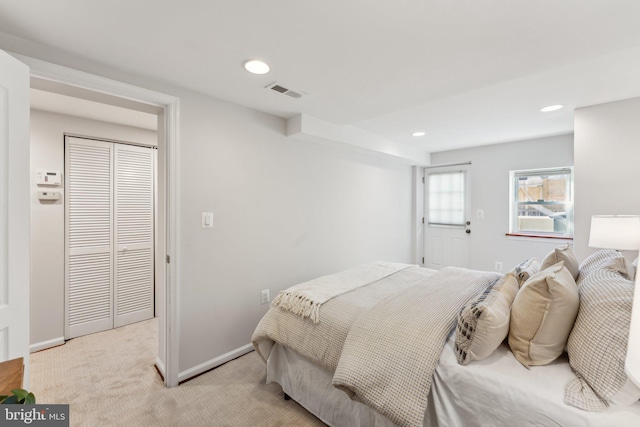 bedroom with light carpet