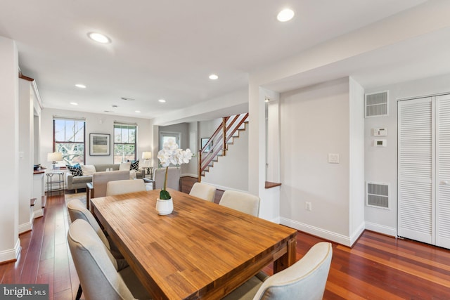 dining room with dark hardwood / wood-style flooring