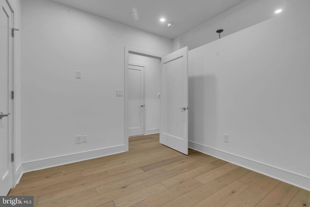 spare room with light hardwood / wood-style flooring