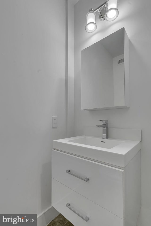 bathroom featuring tile patterned floors and vanity