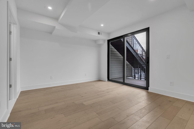 unfurnished room featuring light wood-type flooring