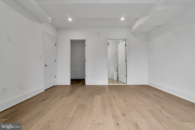 unfurnished room with light wood-type flooring