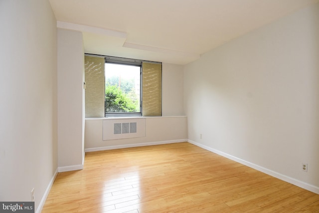 spare room featuring light hardwood / wood-style floors