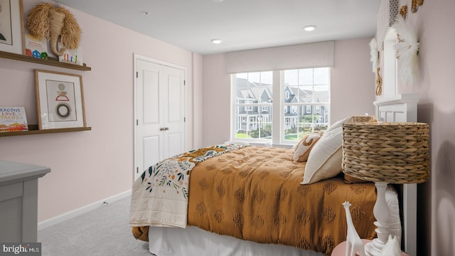 carpeted bedroom featuring a closet