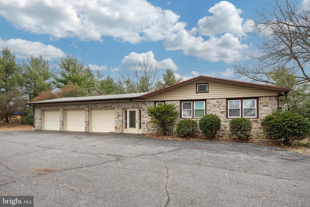 single story home featuring a garage