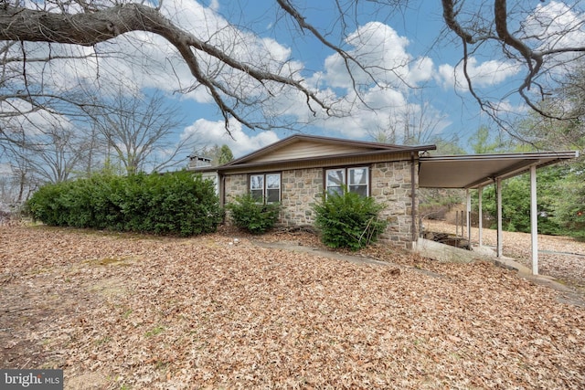 view of property exterior with a carport