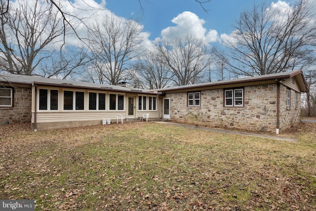 back of house featuring a yard