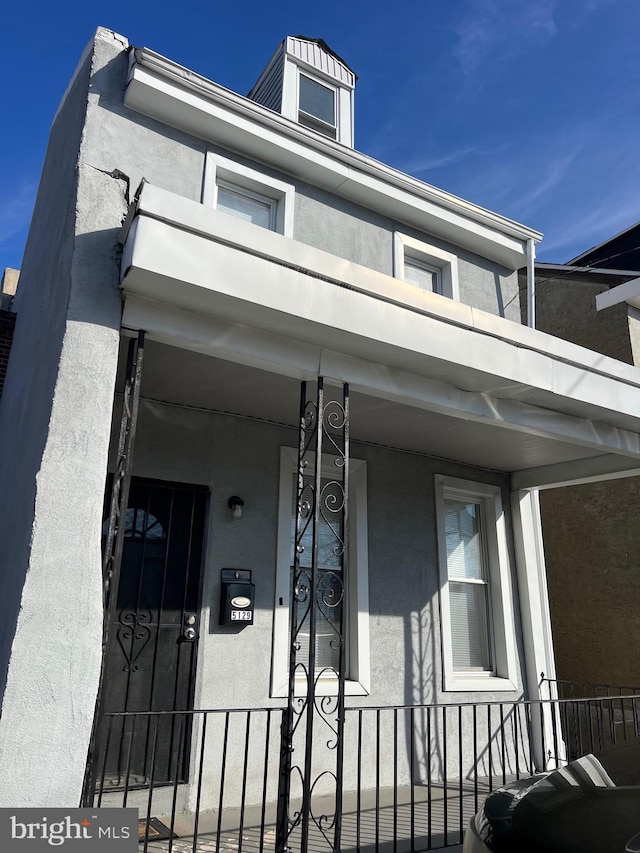 view of home's exterior featuring covered porch