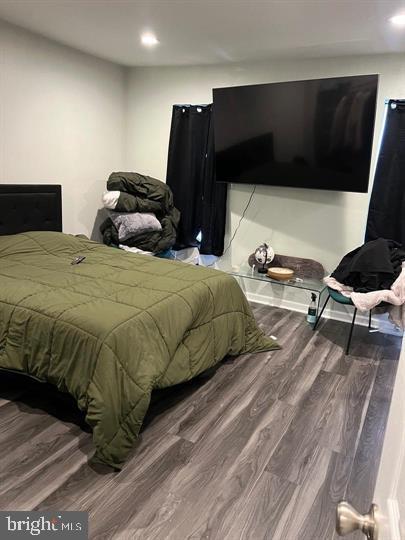 bedroom featuring wood-type flooring