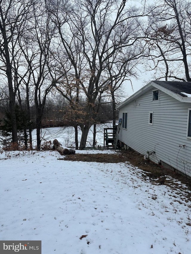 view of yard layered in snow