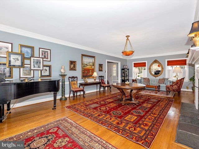 interior space featuring hardwood / wood-style floors and ornamental molding