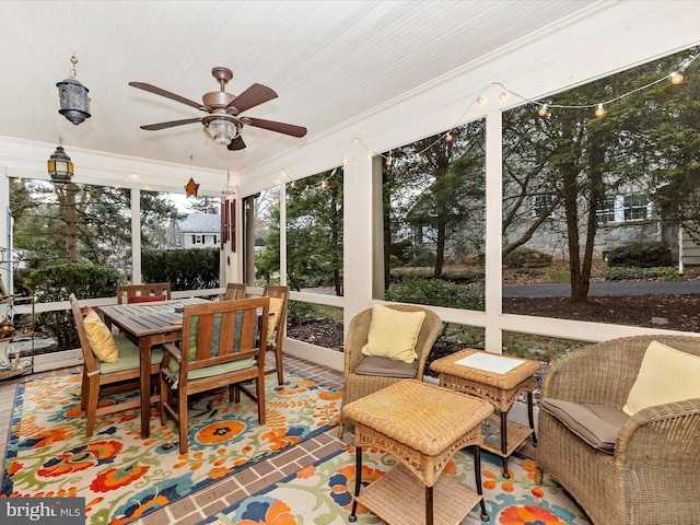 sunroom / solarium with ceiling fan