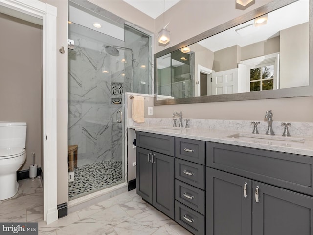 bathroom with vanity, toilet, and walk in shower